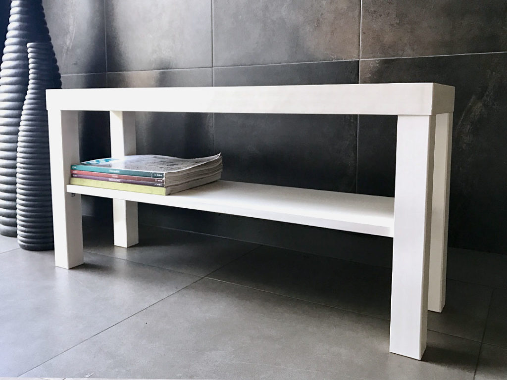 Simple Storage Bench, a white rectangular bench with a lower magazine shelf, on tiled flooring against a tiled wall