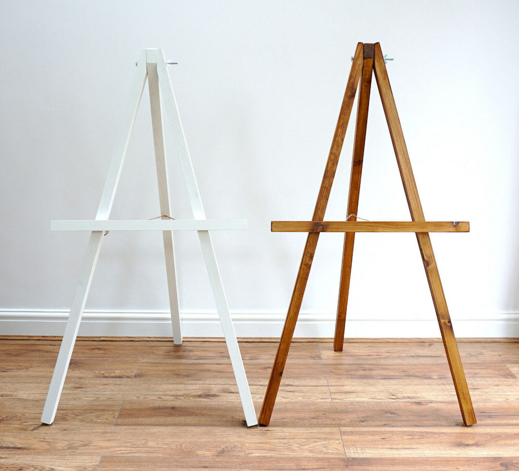 Wedding Easel standing on a wooden floor against a plain white wall