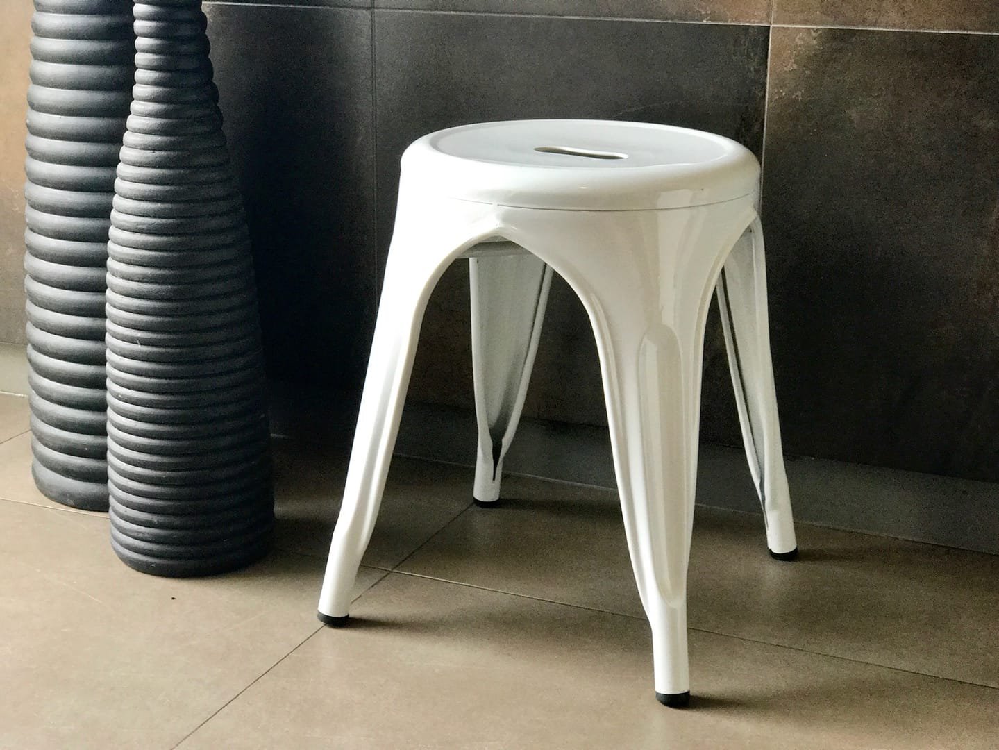 Industrial Stool: The Industrial Stool is a short metal stool from the Tolix line, available in black and white.