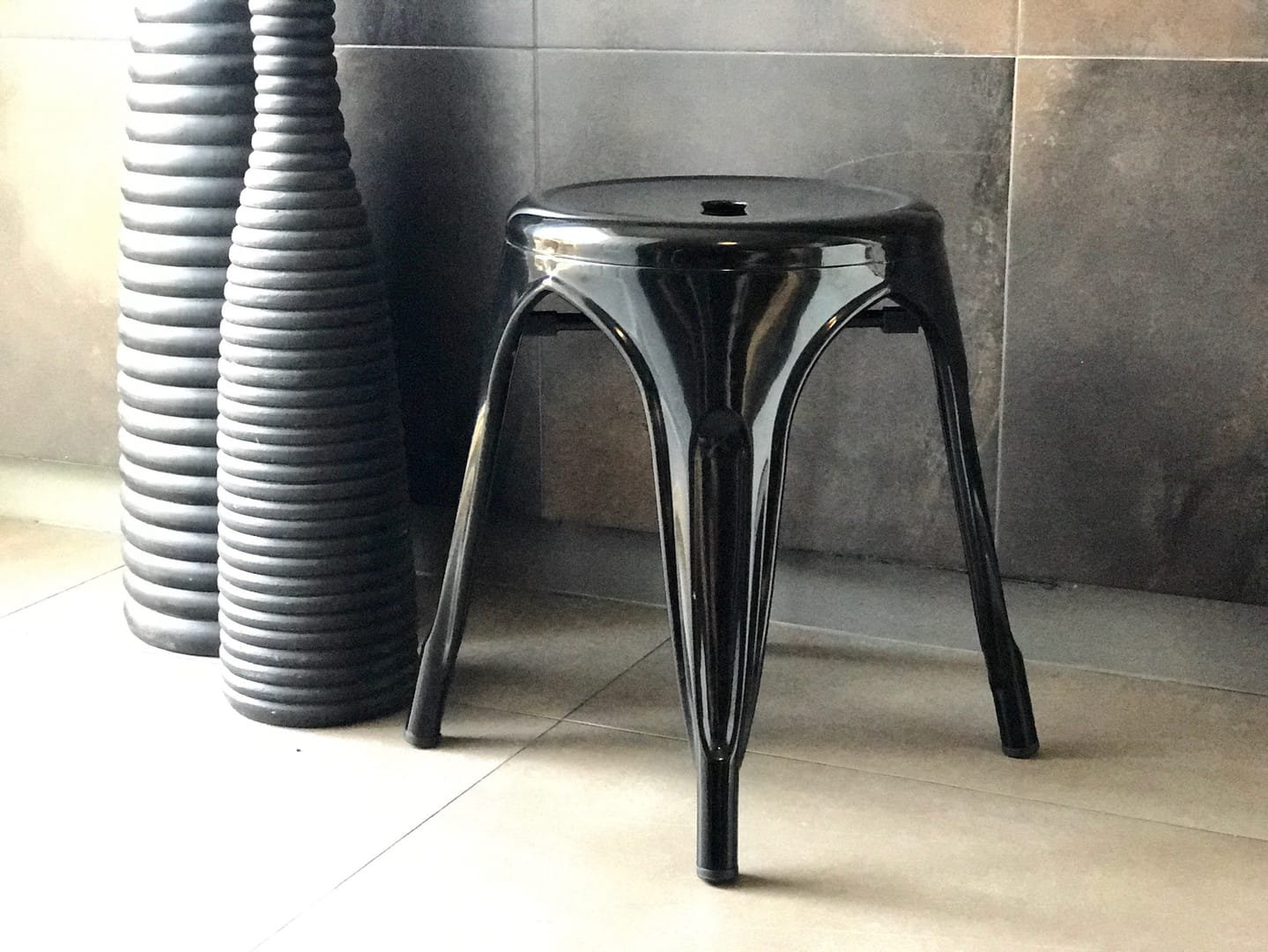 Industrial Stool: The Industrial Stool is a short metal stool from the Tolix line, available in black and white.