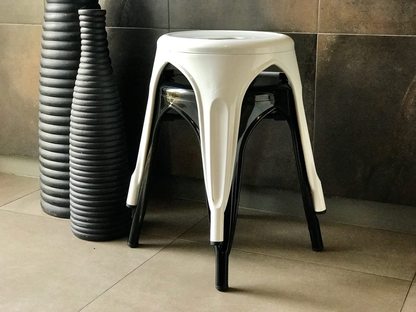Industrial Stool: The Industrial Stool is a short metal stool from the Tolix line, available in black and white.