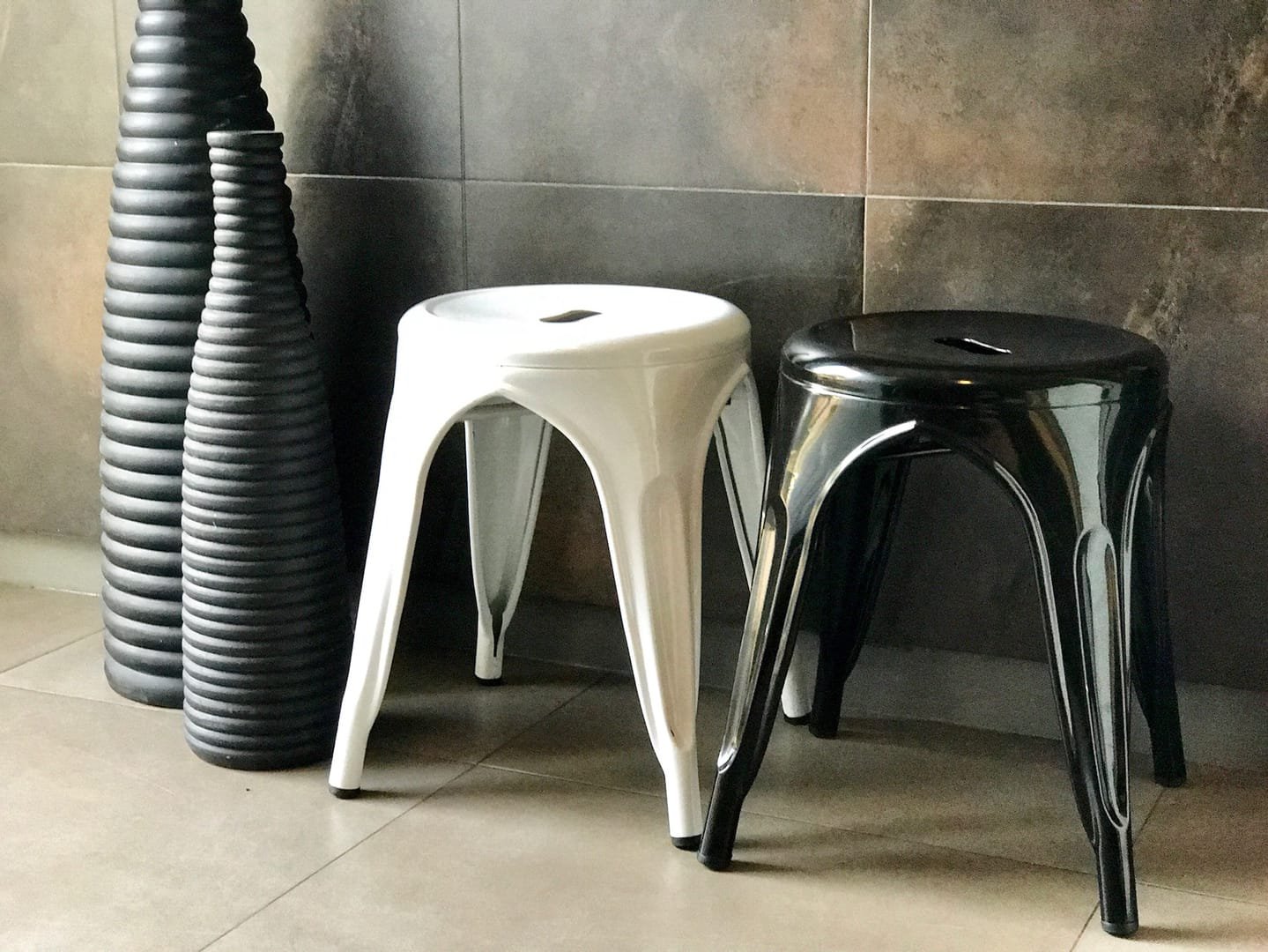 Industrial Stool: The Industrial Stool is a short metal stool from the Tolix line, available in black and white.